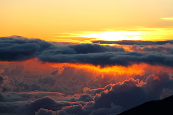Dramatic Sunrise Over Sea of Clouds with Golden Light