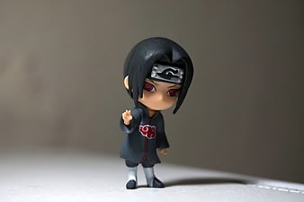 Chibi Sasuke Uchiha Anime Figurine on Neutral Background