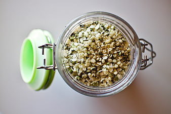 Top-Down View of Shelled Hemp Seeds in Glass Storage Jar
