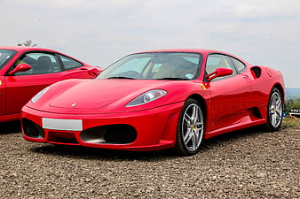 Red Ferrari F430 Supercar Parked on Gravel