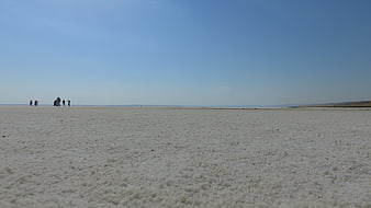 Wide Angle Salt Flat Landscape with Distant Tourists