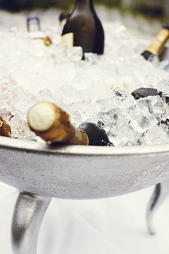 Champagne bottles chilling in ice bucket