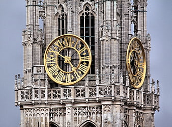 Gothic Cathedral Clock Tower with Golden Dials