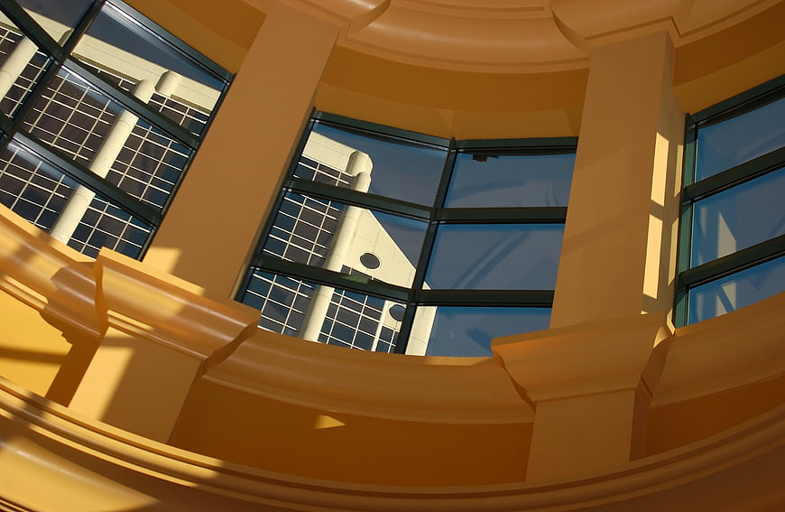Low angle view of beige architectural columns and windows