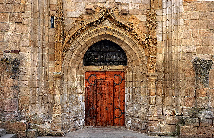 Gothic Stone Archway with Weathered Wooden Door