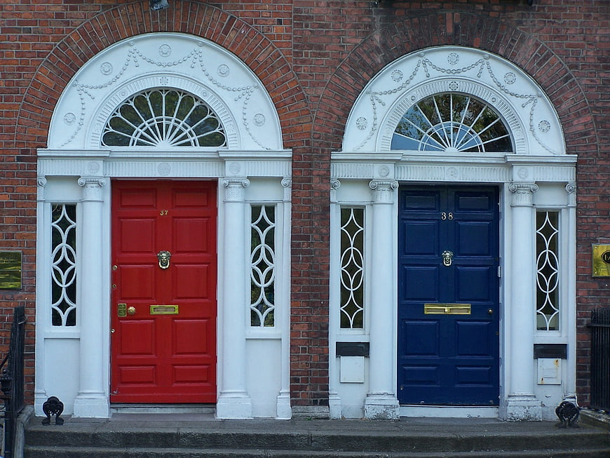Red and Blue Georgian Doors on Brick Facade