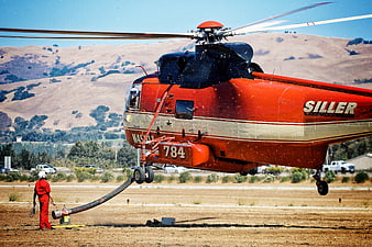 Red Siller Helicopter Refueling on Dry Airfield