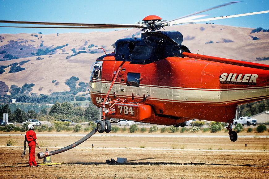 Red Siller Helicopter Refueling on Dry Airfield