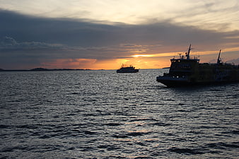 Silhouette of Ferry and Ship on Sea at Sunset