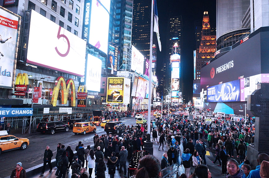 Crowded Times Square NYC Night with Bright Billboards