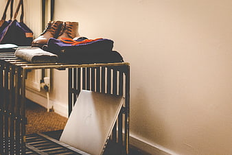 Laptop and boots on industrial crate table with copyspace