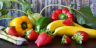 Fresh Assorted Fruits and Vegetables on Wooden Background