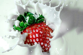 Fresh Strawberry Splashing into White Milk Splash