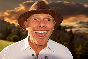 Funny man in hat with exaggerated expression outdoors