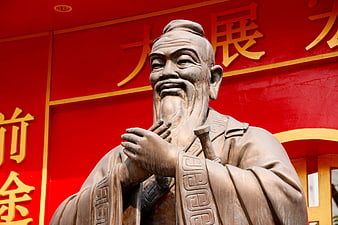 Bronze Statue of Confucius with Red Background