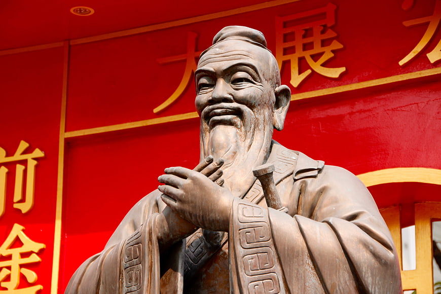 Bronze Statue of Confucius with Red Background