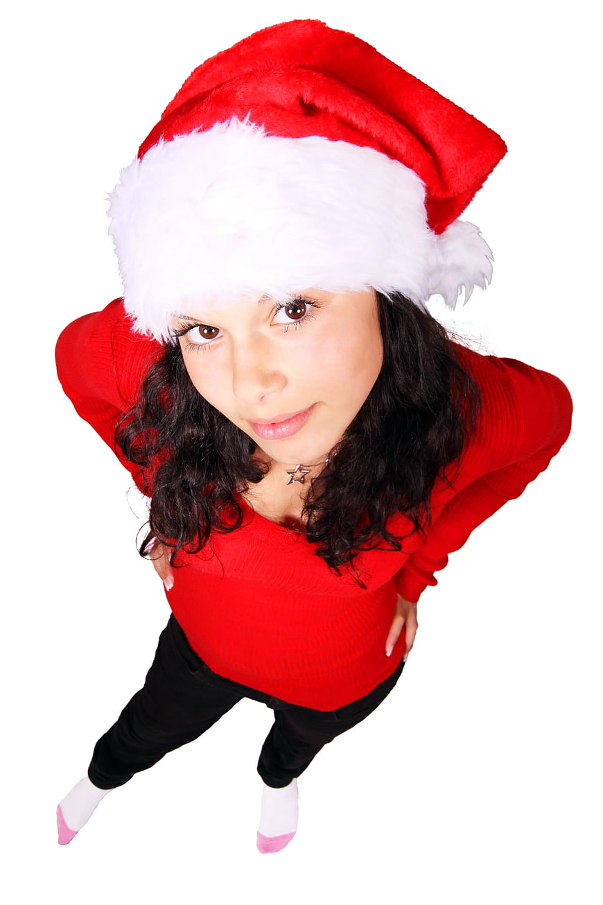 High Angle Portrait of Woman in Santa Hat and Red Sweater