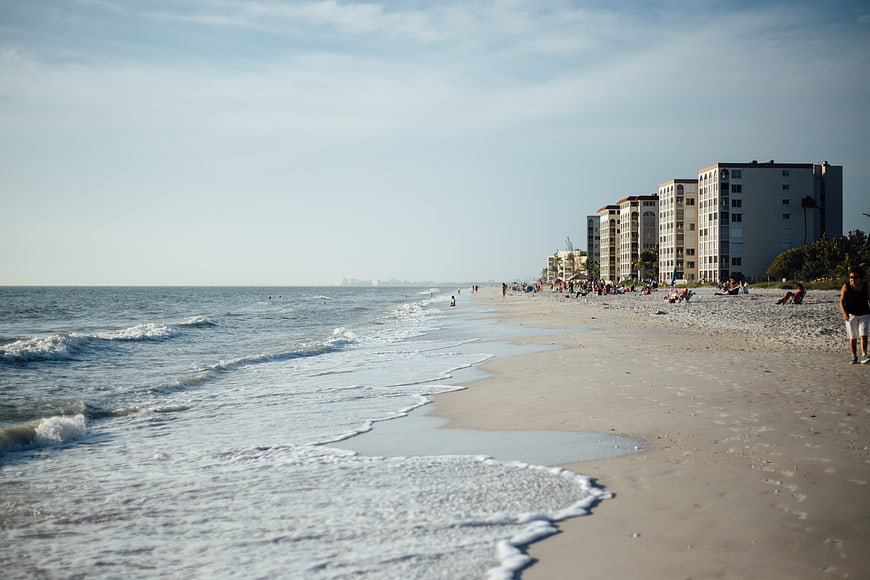 Wide Beach View with Ocean Waves and Coastal Hotels