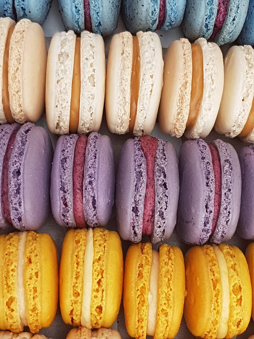 Colorful Macarons Arranged In Rows On A Tray