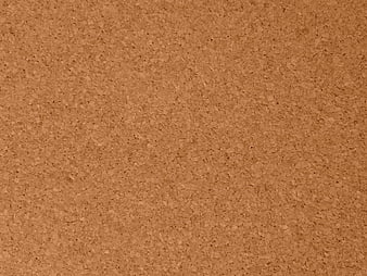 Close-up texture of brown cork board surface background