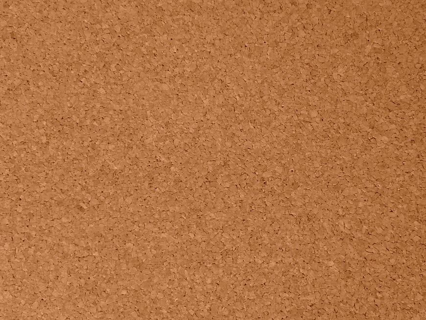 Close-up texture of brown cork board surface background