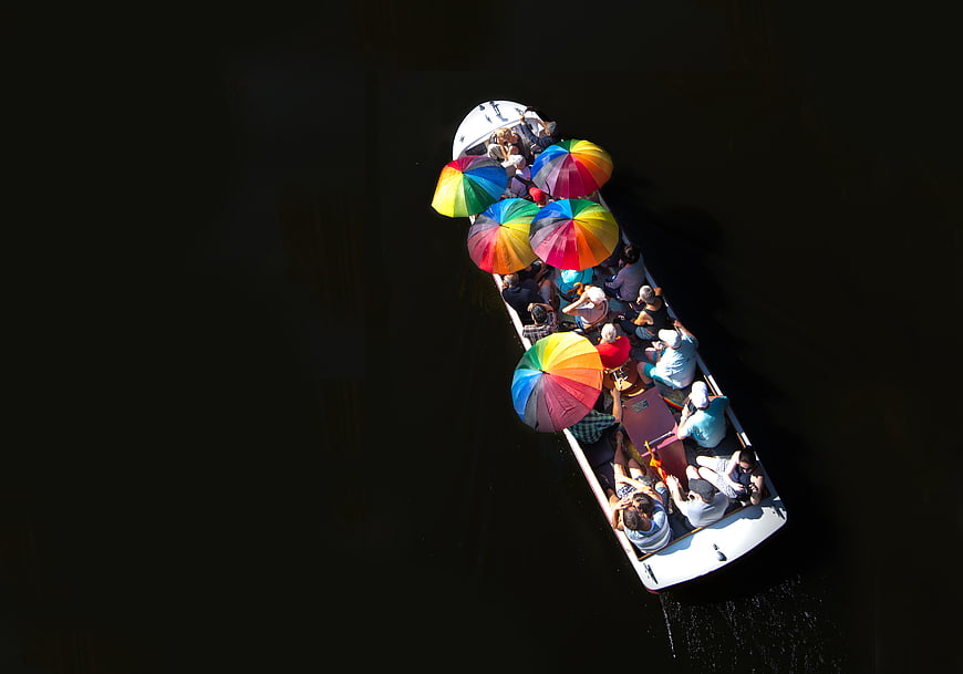 Aerial View of Tourist Boat with Colorful Umbrellas