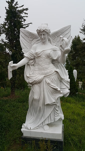White Marble Angel Statue in Garden