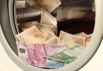 Euro banknotes inside a washing machine drum