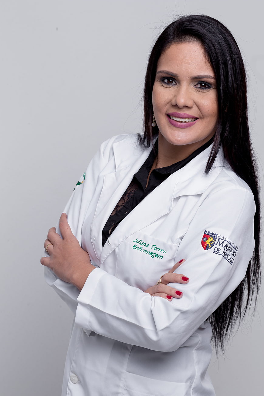 Professional female nurse in white lab coat smiling