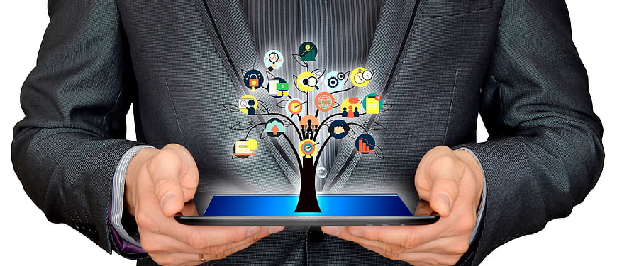 Businessman Holding Tablet With Digital Business Strategy Tree Concept