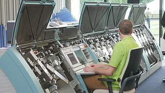 Operator using large industrial banknote counting machine