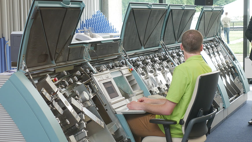 Operator using large industrial banknote counting machine