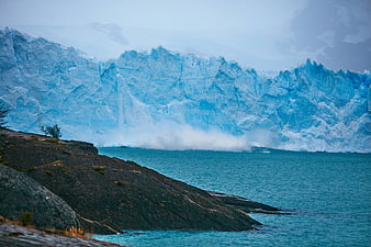 Majestic Blue Glacier Calving into Turquoise Lake