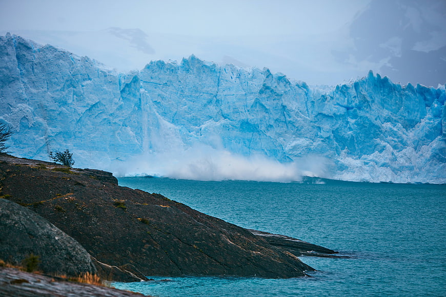 Majestic Blue Glacier Calving into Turquoise Lake