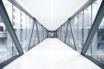 Modern Glass Skybridge Corridor with Steel Beams