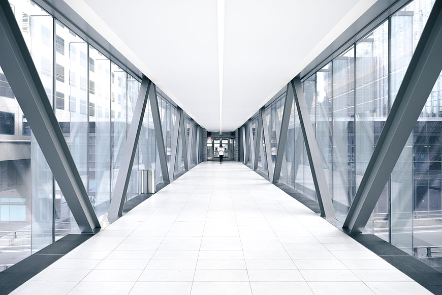Modern Glass Skybridge Corridor with Steel Beams