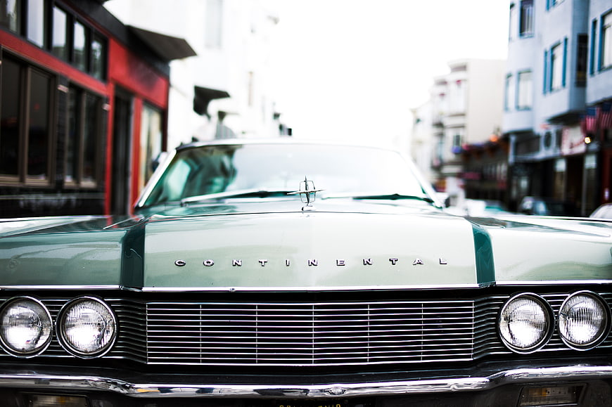 Front view of vintage green Lincoln Continental on city street