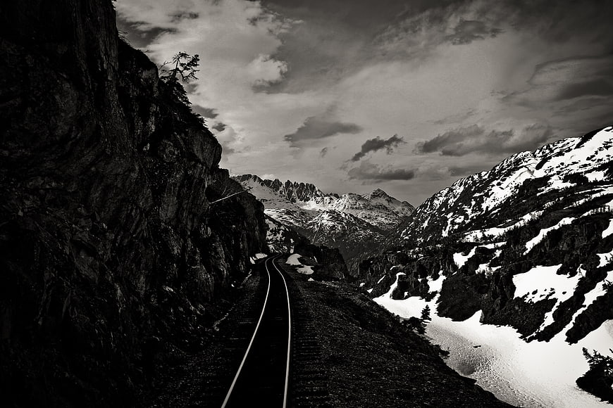 Dramatic Black and White Mountain Railway Tracks