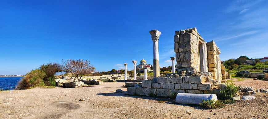 Ancient Greek Ruins by the Sea Under Blue Sky