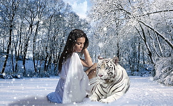 Woman in white dress sitting with white tiger in snowy winter forest