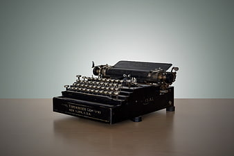 Vintage Royal Typewriter on Wooden Table with Gray Background