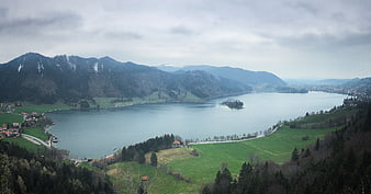 Panoramic View of Alpine Lake with Island and Mountains