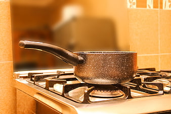 Speckled Saucepan on Gas Stove Burner