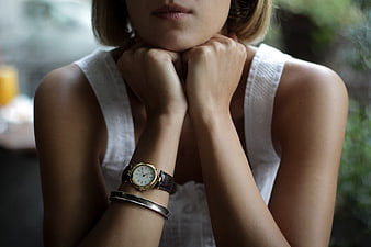 Close-up of Woman Wearing Gold Watch and Bracelet