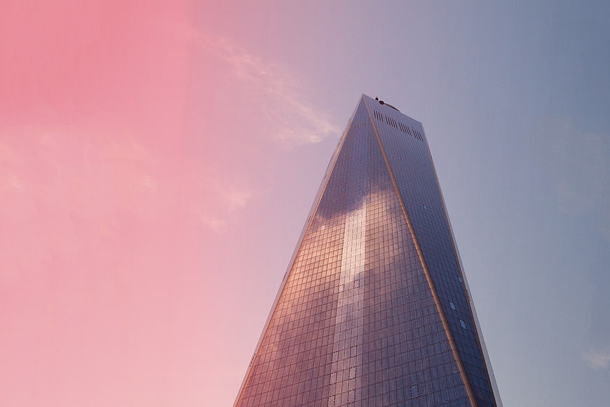 One World Trade Center reflecting pink sunset sky
