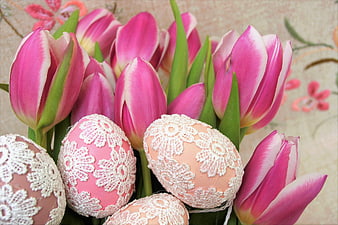 Pink Tulips And Lace-Decorated Easter Eggs On Floral Tablecloth