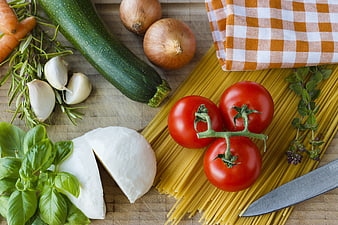 Fresh Italian Pasta Ingredients on Wooden Board