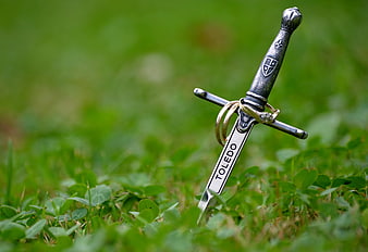 Miniature Sword with Wedding Rings in Green Grass