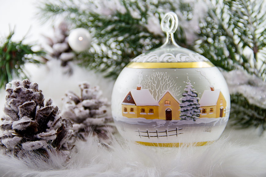 Hand-painted Christmas ornament with winter village scene