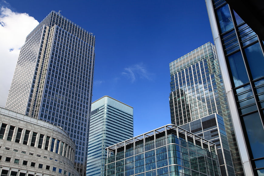 Modern Glass Skyscrapers Against Blue Sky
